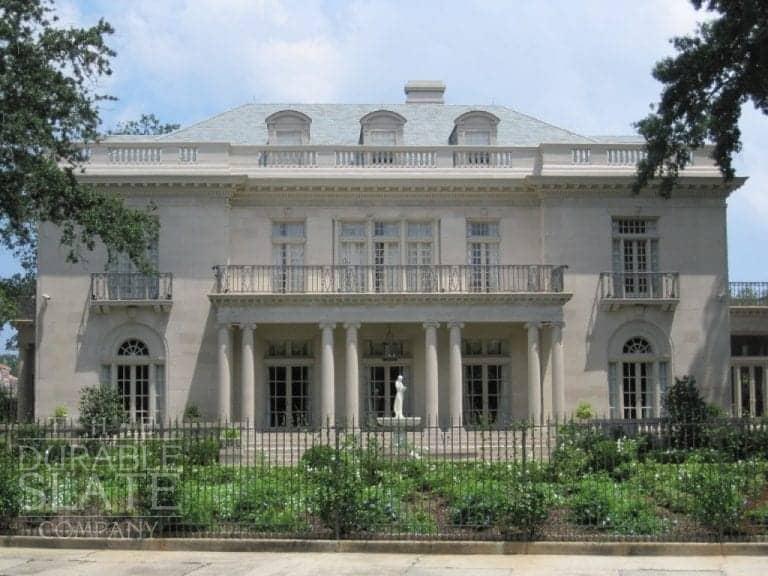 The Benjamin Monroe House as seen from the front with white statue in the center