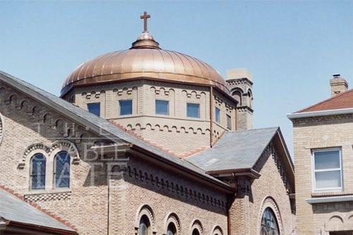 new copper standing seam roof on the dome of the church