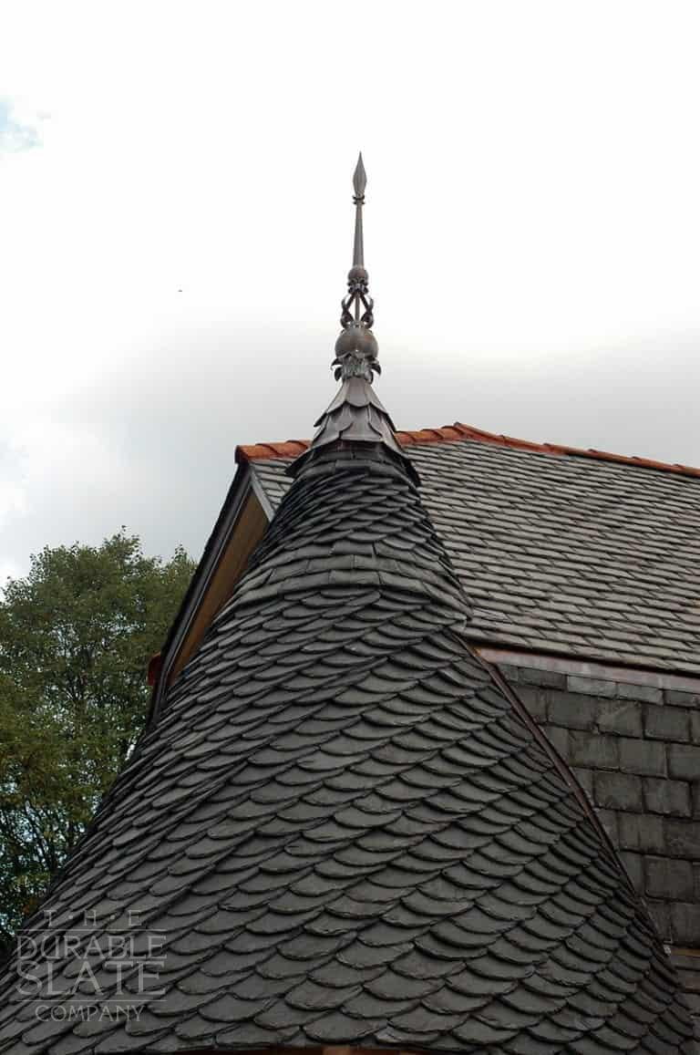 Turret is a sprawling ranch house that we changed into an old looking mansion. We used salvaged Peach Bottom slate from Pennsylvania to give it a look like it's always been there. We installed the turret in a German installation method.