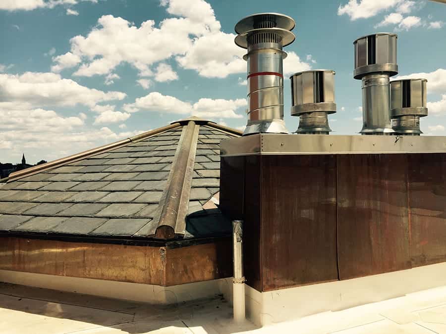 the ivy hotel roof, thermal vents, copper flashing, and chimney