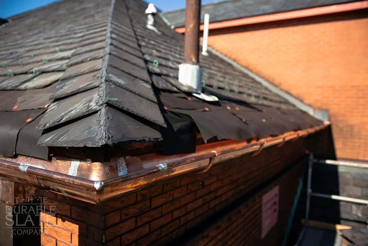 slate ridge, slate roof, and copper gutters