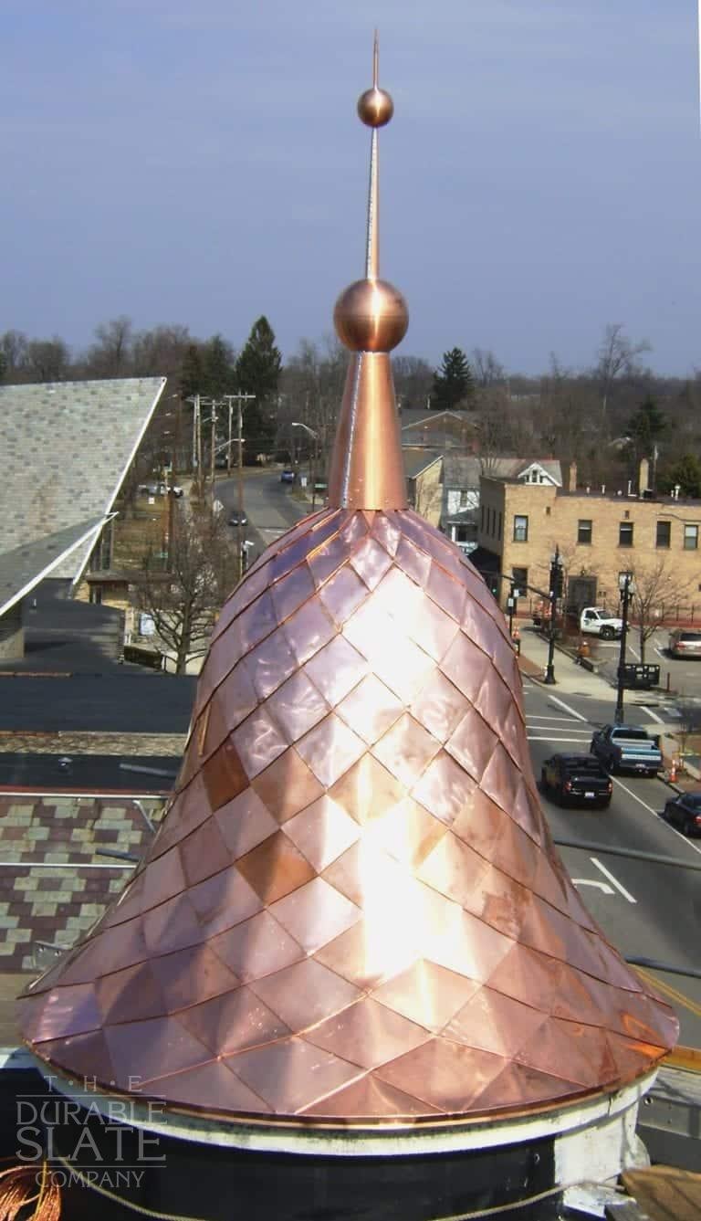 delicate copper shingles installed to an ornamental copper bell