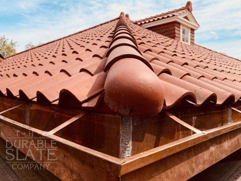 a close shot of spanish red roofing tiles in from a repaired home in south carolina