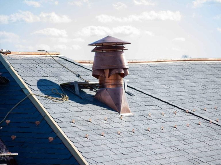 closeup of walter reed medical center and its repaired slate roof and copper thermal ornaments