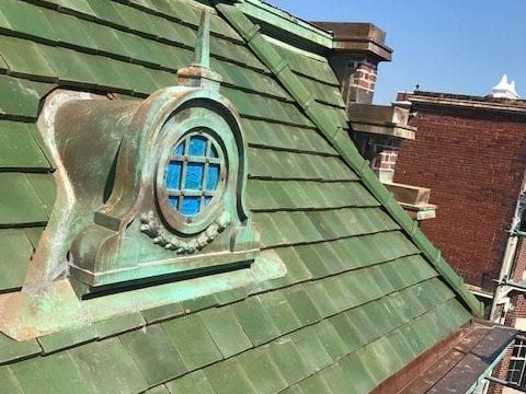 green tile roof and copper dormer on private residence in washington d.c.