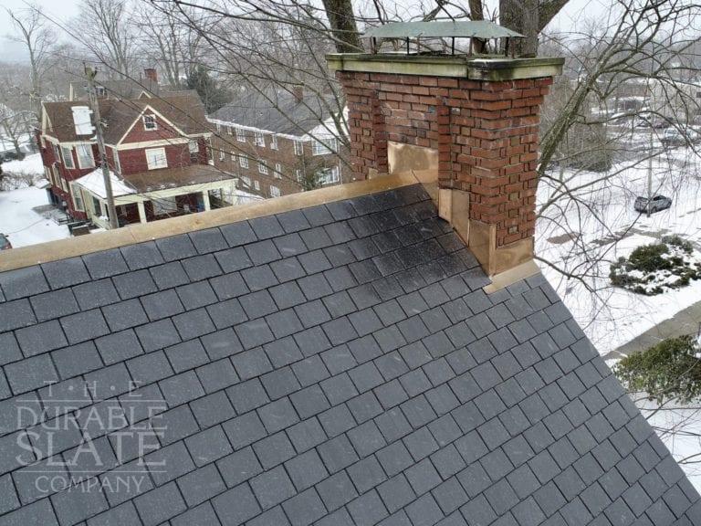 a lightning strike damaged this akron roof, requiring new slate, copper flashing