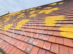 st. mary's catholic church in iowa clay roofing tile repair underway
