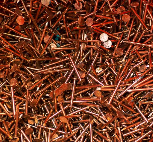 a pile of copper nails