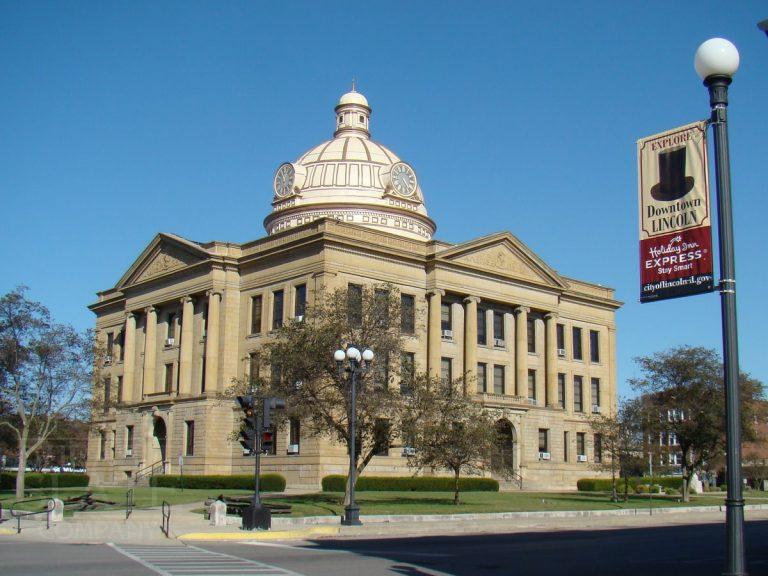 a sign in front of a building