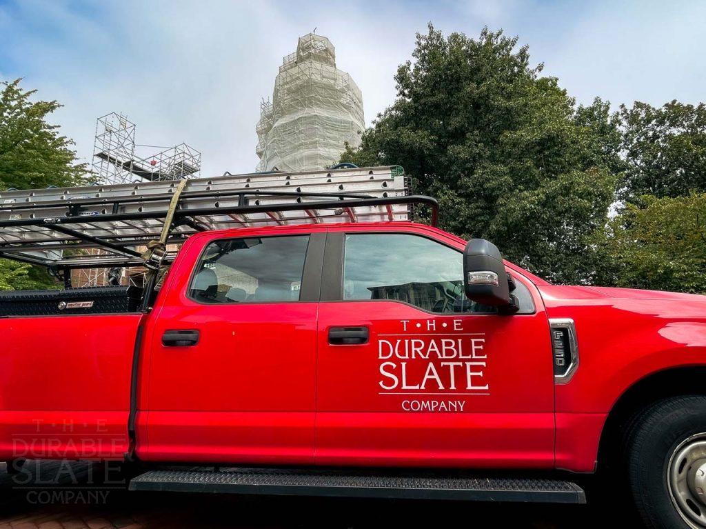 a fire truck parked in front of a car
