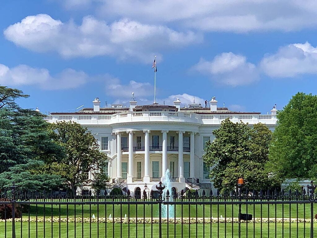 a large building with White House in the background
