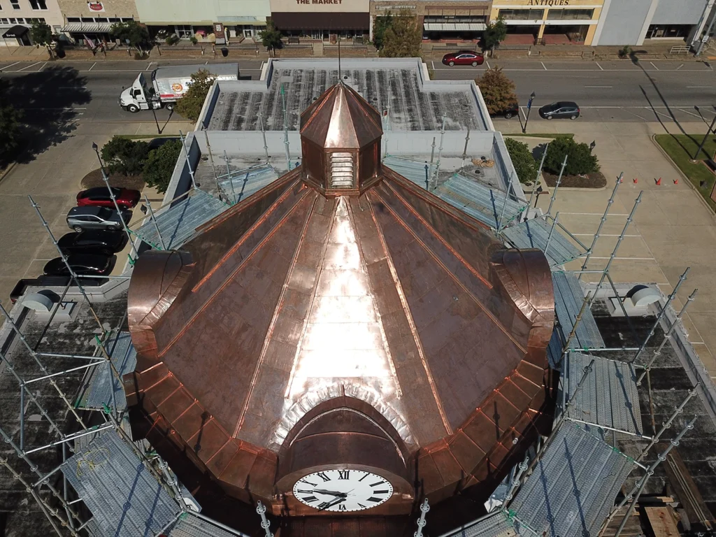 In 2024, The Durable Slate Company meticulously restored the historic Morehouse Parish Courthouse in Bastrop, Louisiana. Originally constructed in 1914, this iconic Beaux Arts-style building features a distinctive four-stage dome. Our team's scope of work included the careful removal and replacement of the copper roof and cupola, ensuring the preservation of this architectural landmark's grandeur for future generations.
